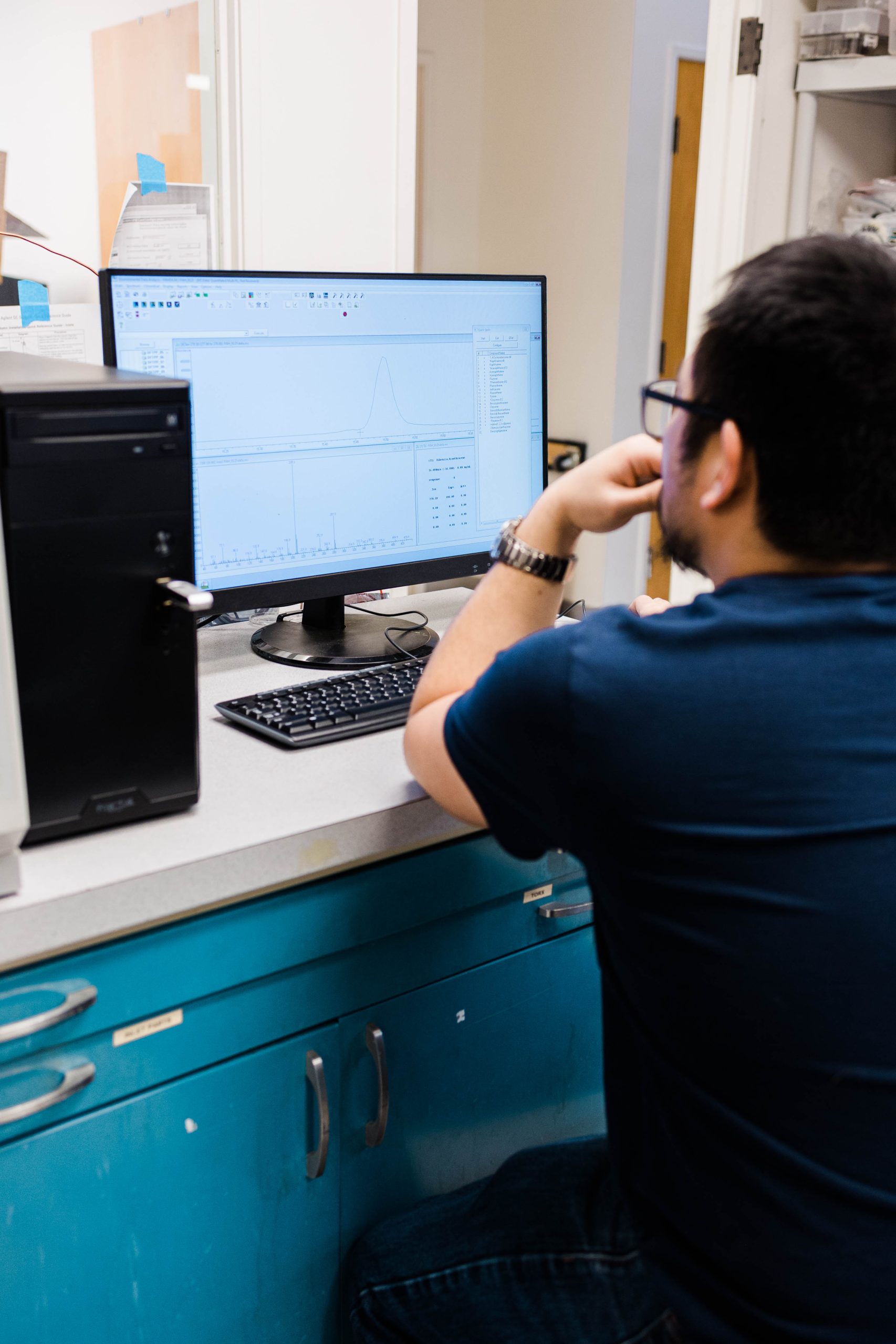 A man looking over the results of plant testing.