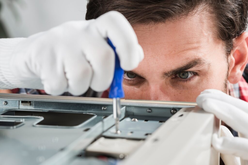 A man building lab equipment.